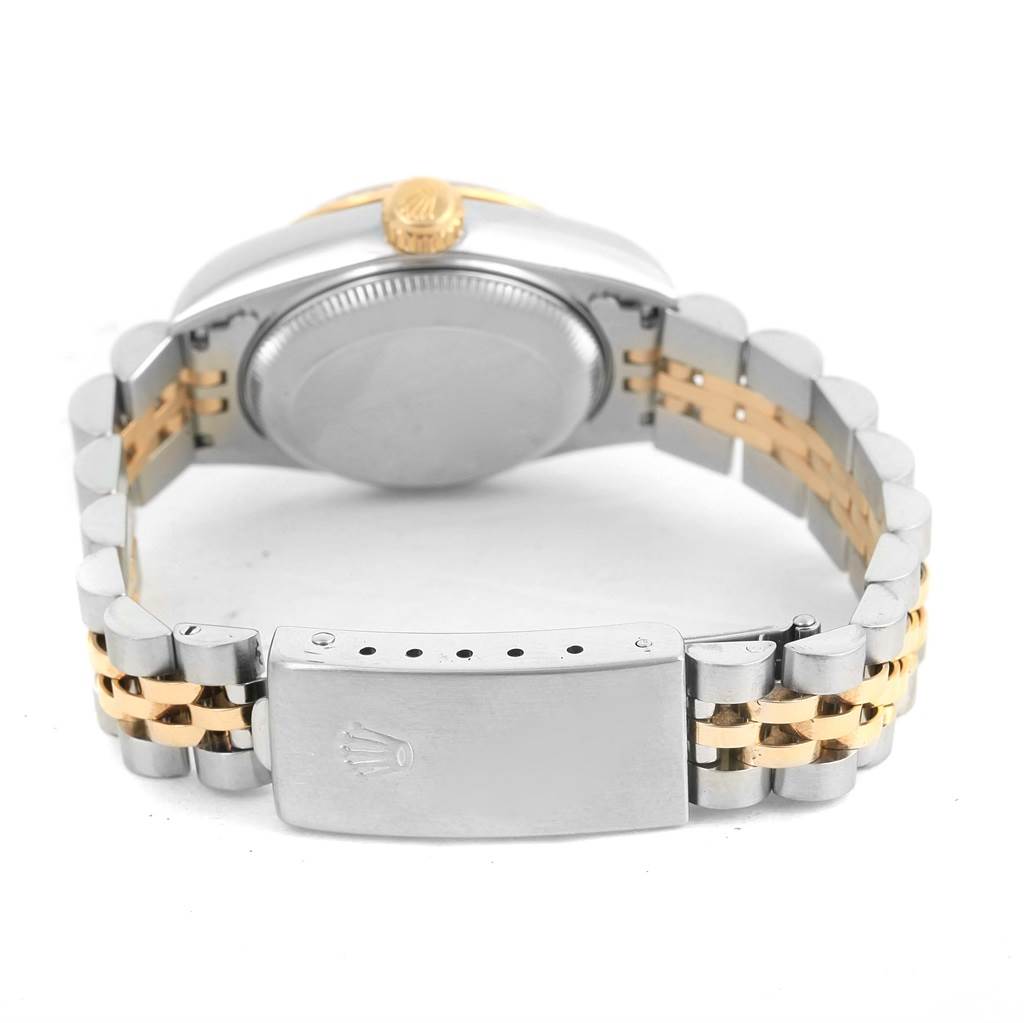 This image shows the back of the Rolex Datejust 79173 Women's Stainless Steel Champagne Dial 79173 Women's Stainless Steel Champagne Dial watch, including the case, crown, and two-tone metal bracelet with a clasp.