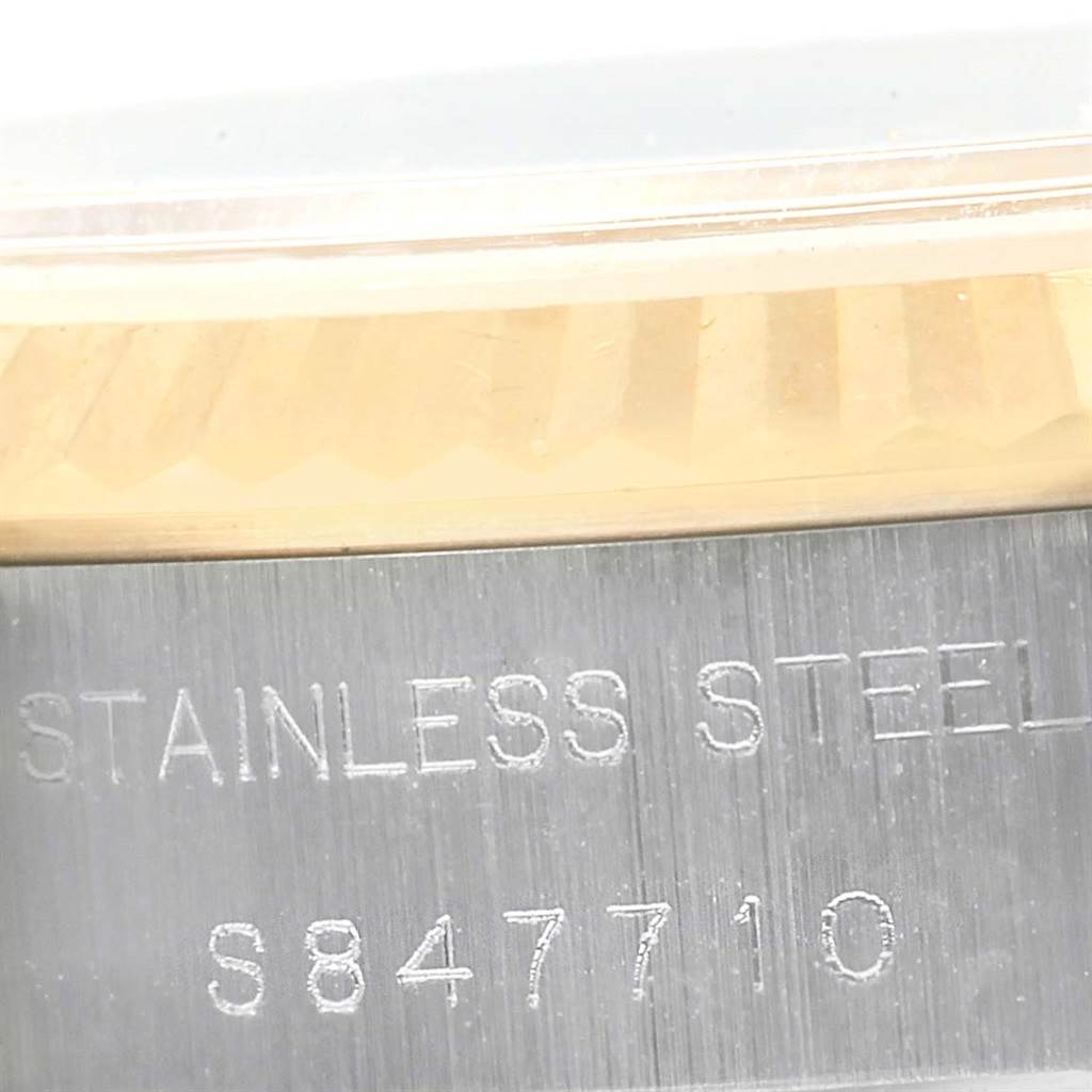 This close-up shows the stainless steel side of the Rolex Datejust 69173 Women's Stainless Steel Champagne Dial 69173 Women's Stainless Steel Champagne Dial watch case, including a portion of its serial number.