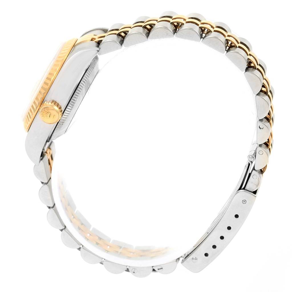 Side view of a Rolex Datejust 69173 Women's Stainless Steel Champagne Dial 69173 Women's Stainless Steel Champagne Dial watch showing the crown, bezel, case, and jubilee bracelet.