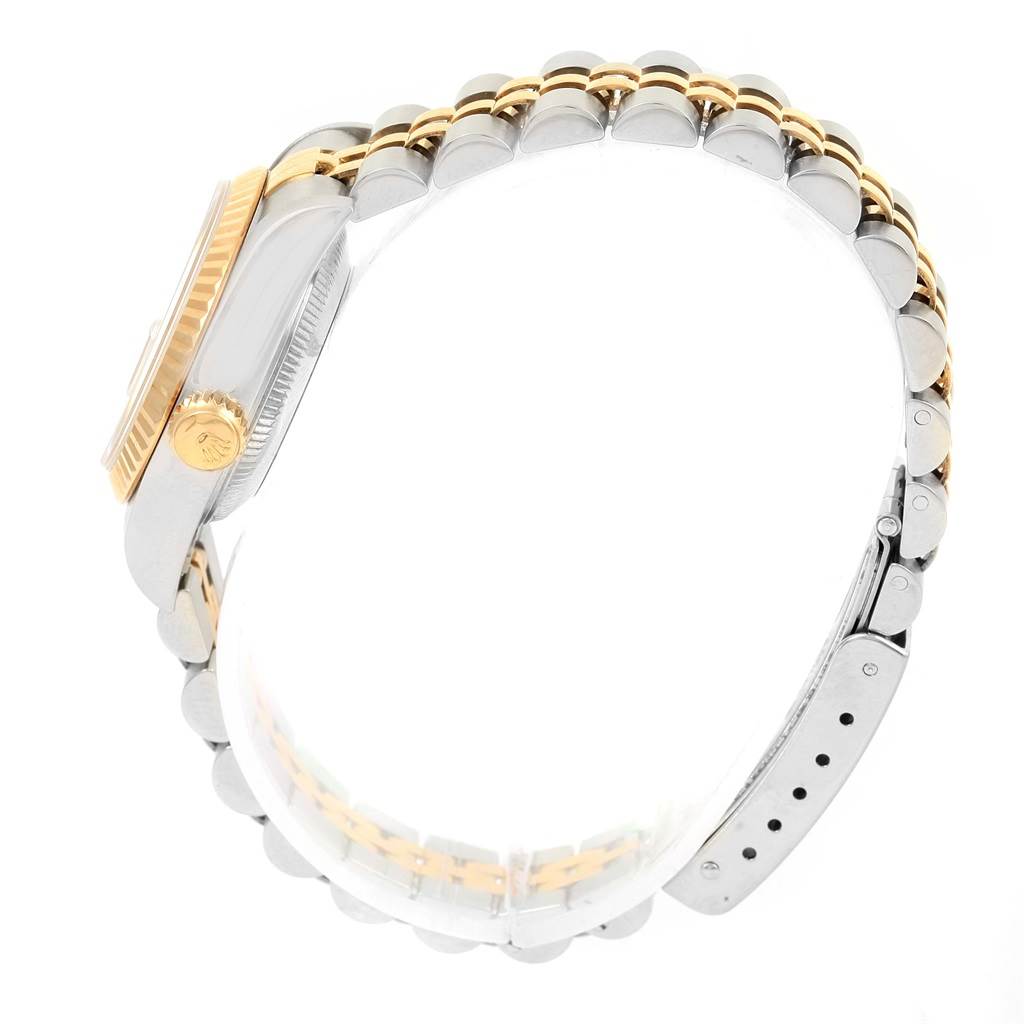 The image shows a side view of the Rolex Datejust 69173 Women's Stainless Steel Champagne Dial 69173 Women's Stainless Steel Champagne Dial watch, highlighting its crown, case, and two-tone bracelet.