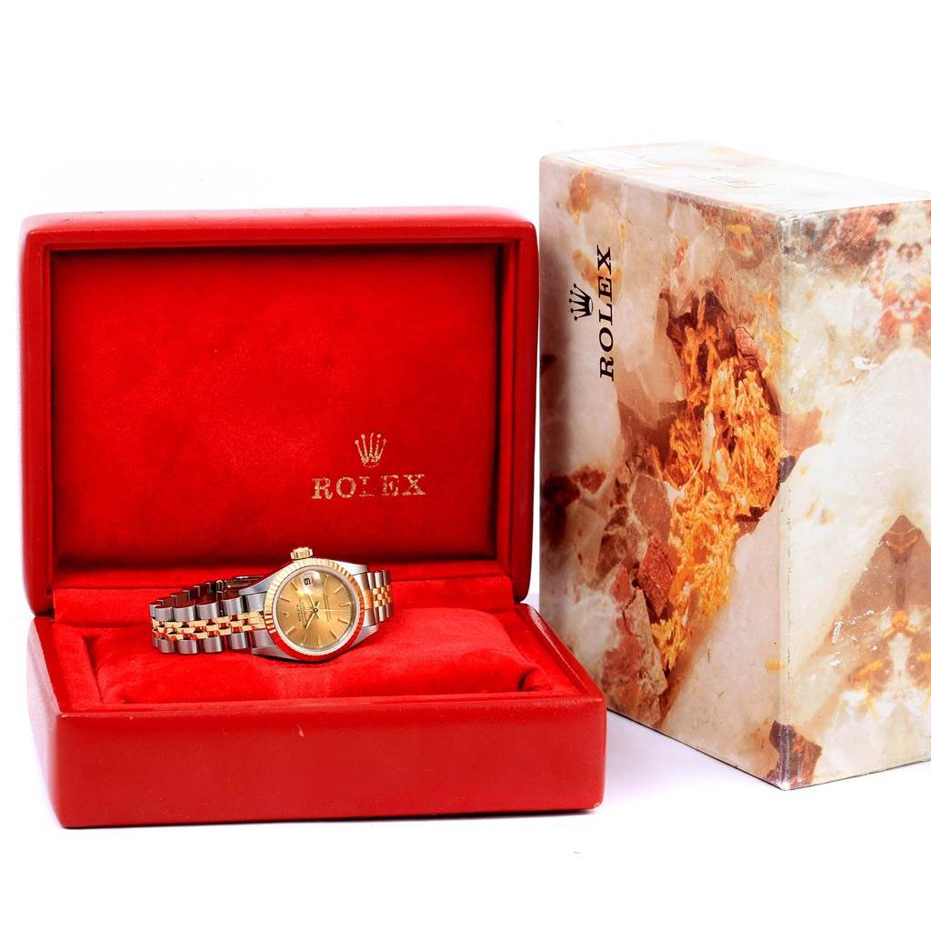 The Rolex Datejust 69173 Women's Stainless Steel Champagne Dial 69173 Women's Stainless Steel Champagne Dial watch is shown in its open red box, displaying the dial and two-tone bracelet.