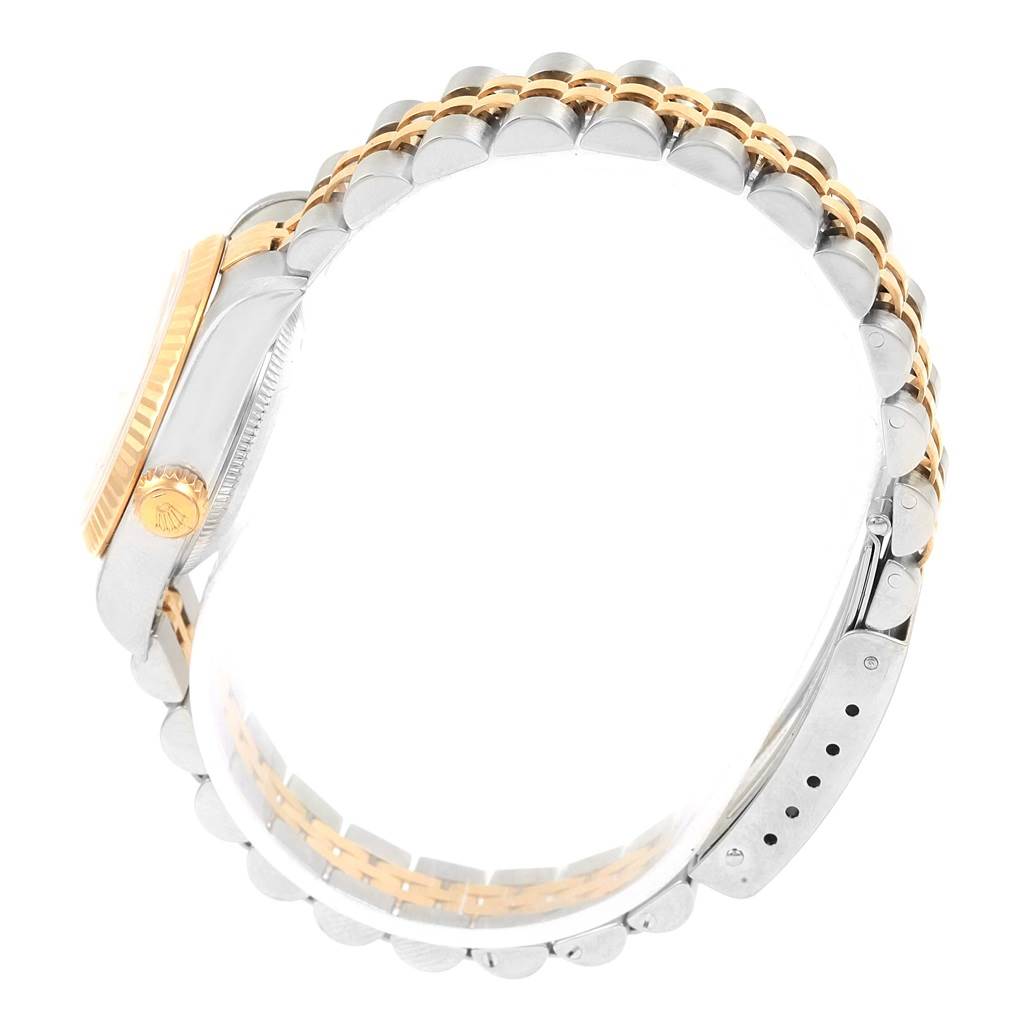 This image shows the side view and partial bracelet of the Rolex Datejust 79173 Women's Steel and Gold (two tone) White Dial 79173 Women's Steel and Gold (two tone) White Dial, emphasizing its two-tone bracelet and crown.