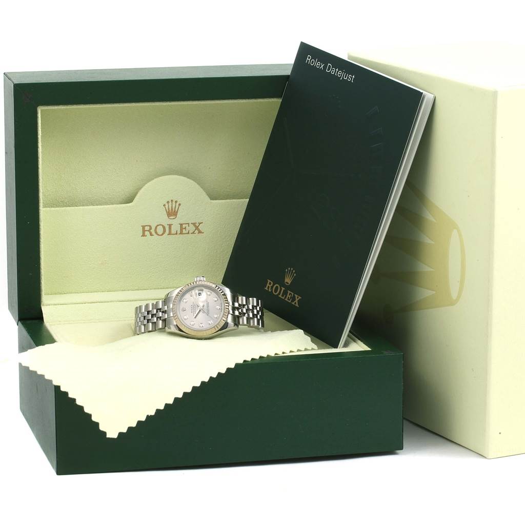 The image shows a Rolex Datejust 179174 Women's Stainless Steel Silver Dial 179174 Women's Stainless Steel Silver Dial watch laid in its original packaging with an instruction booklet inside the box.