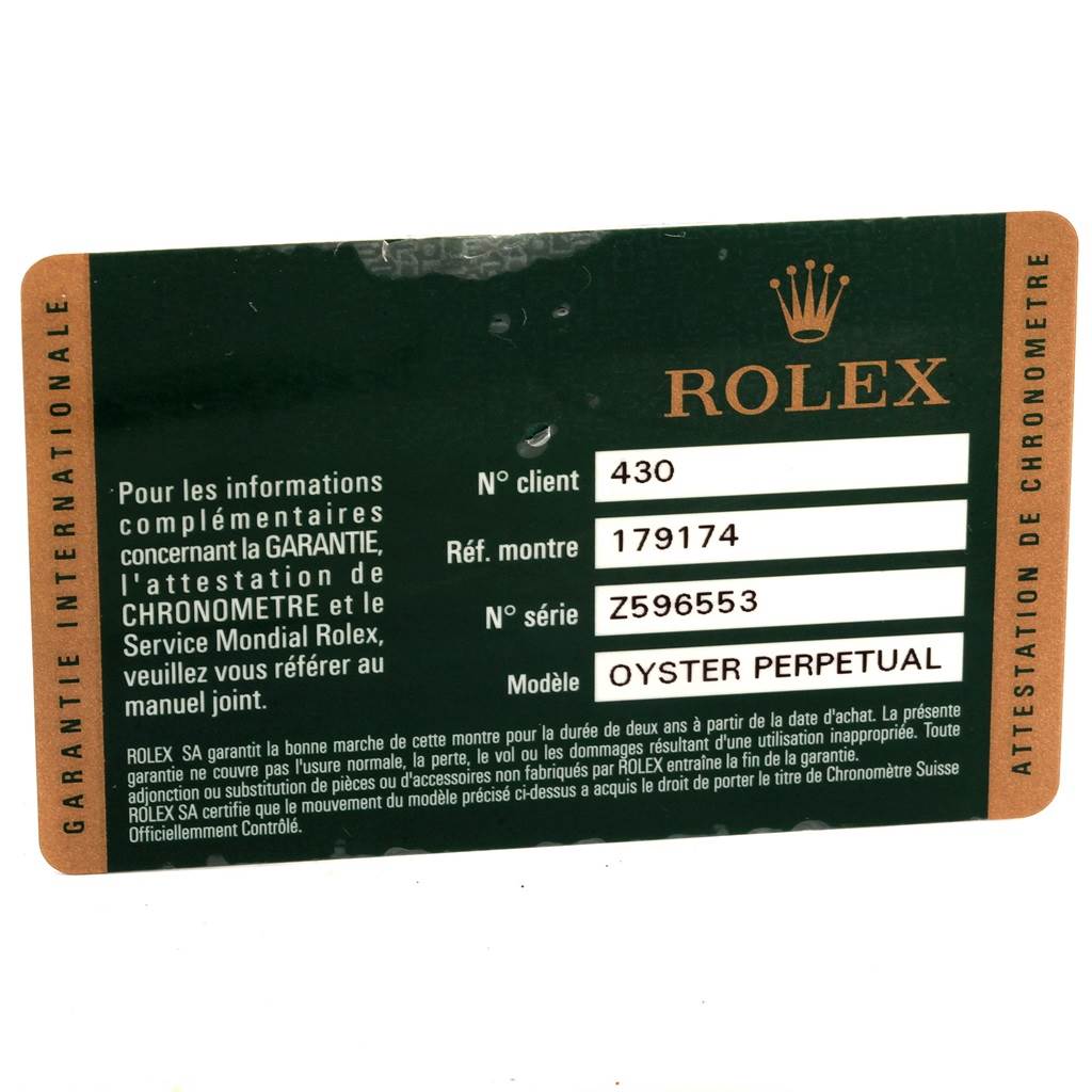 This is a Rolex Datejust 179174 Women's Stainless Steel Silver Dial 179174 Women's Stainless Steel Silver Dial model warranty card, featuring model and serial numbers and brand logo.