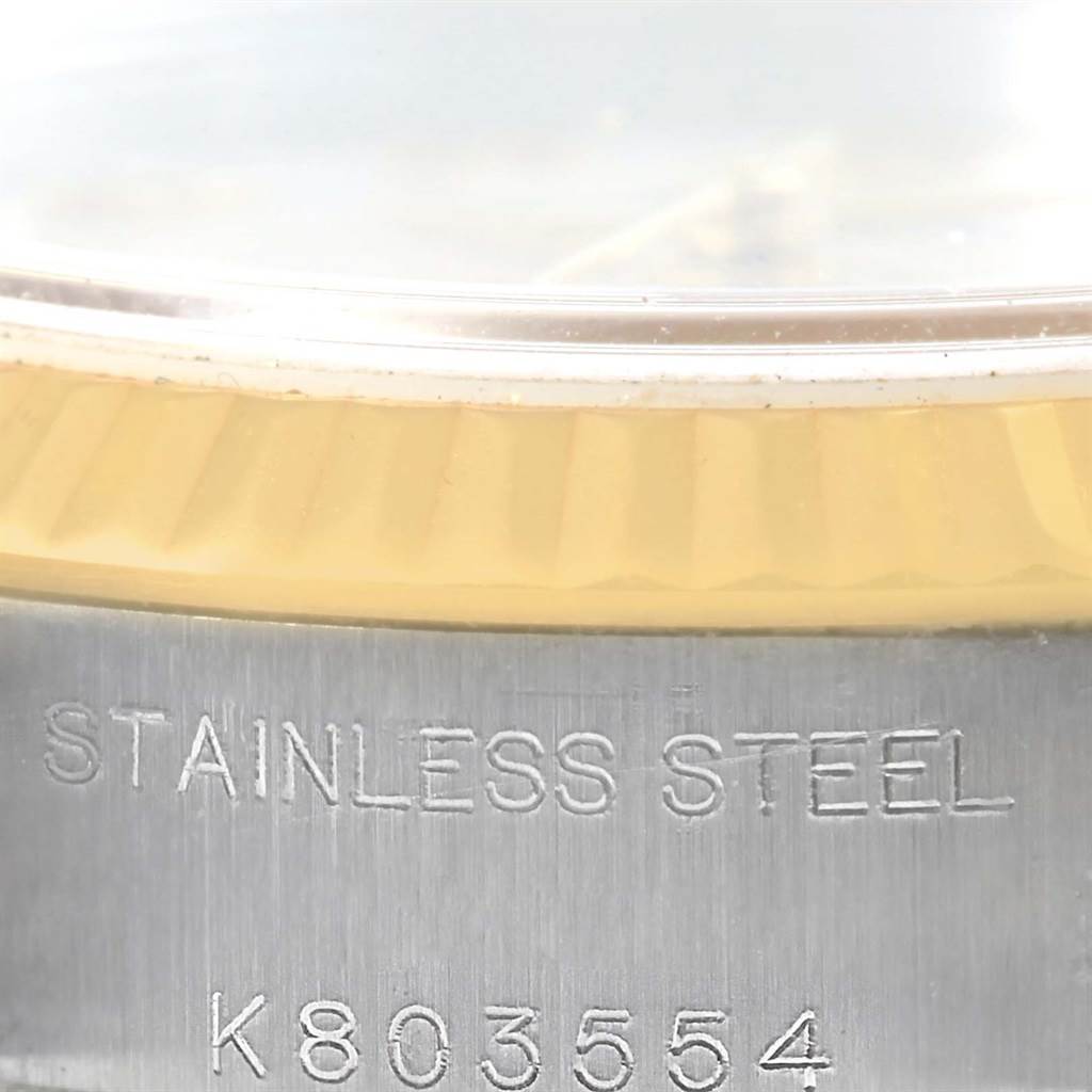 The image shows a close-up of the stainless steel casing and fluted bezel of a Rolex Datejust 79173 Women's Steel and Gold (two tone) Beige Dial 79173 Women's Steel and Gold (two tone) Beige Dial watch with the serial number visible.