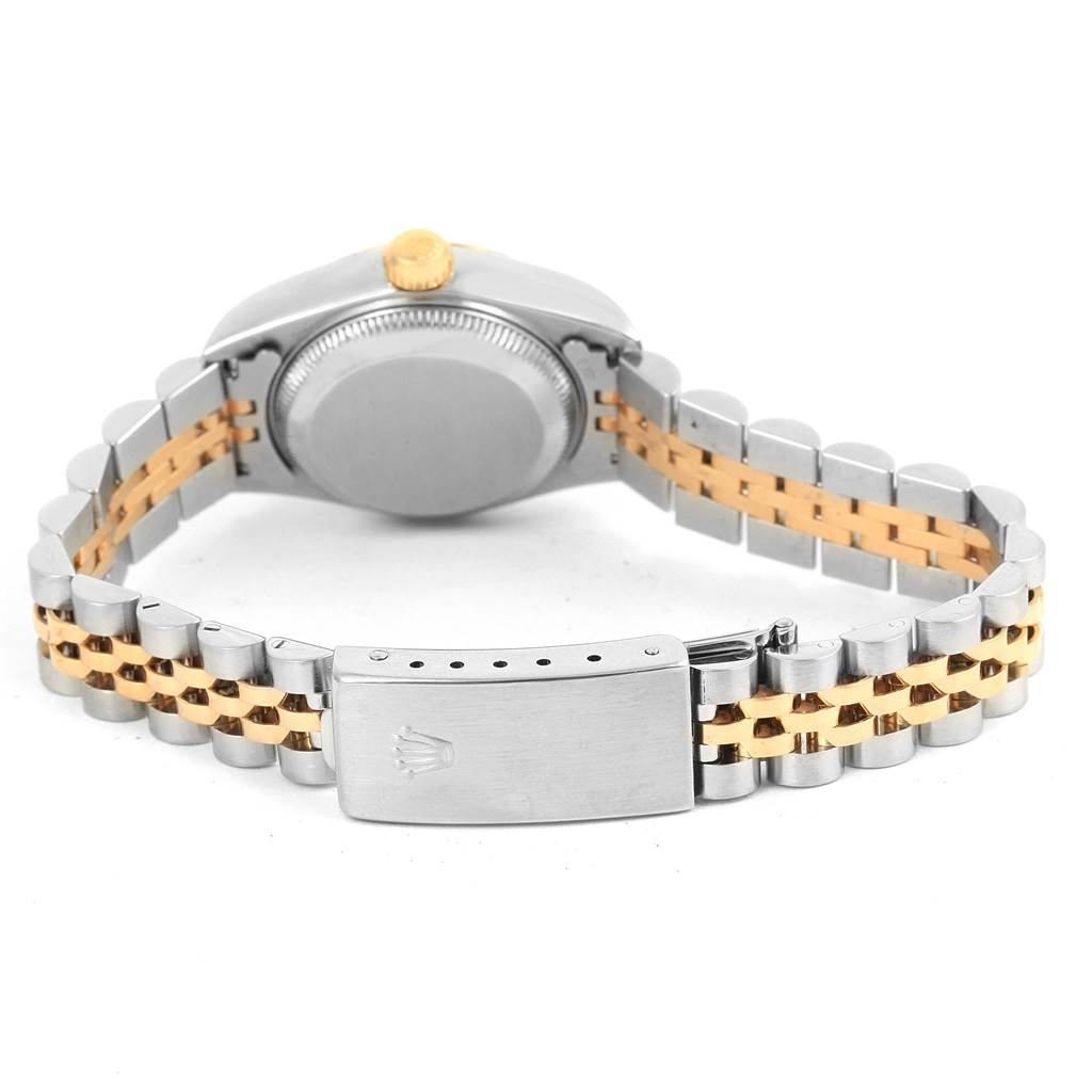 The image shows the back view of a Rolex Datejust 79173 Women's Steel and Gold (two tone) Beige Dial 79173 Women's Steel and Gold (two tone) Beige Dial watch, highlighting its clasp, bracelet, and case back.