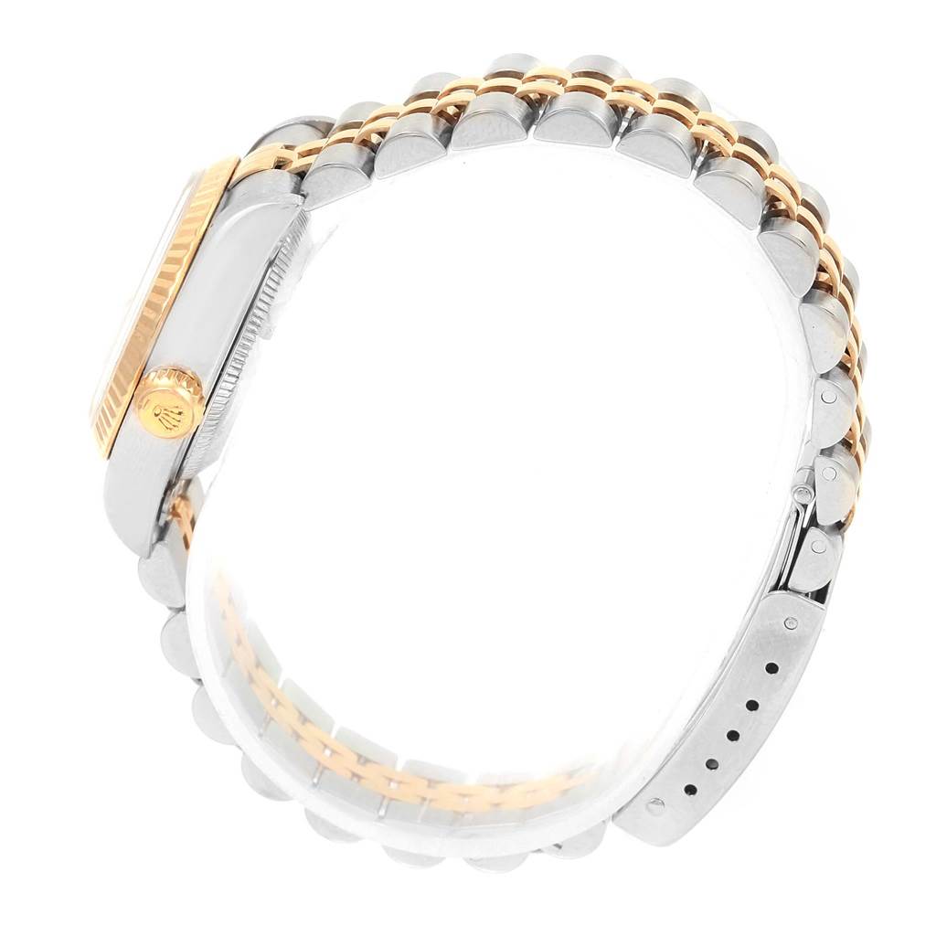 The Rolex Datejust 69173 Women's Stainless Steel White Dial 69173 Women's Stainless Steel White Dial watch is shown from a side angle, highlighting the case, crown, and two-tone bracelet.