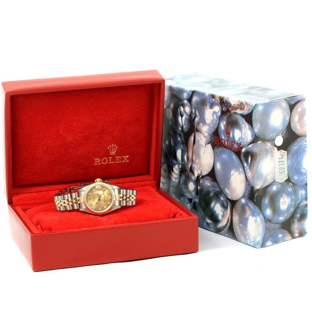 The image shows a Rolex Datejust 69173 Women's Stainless Steel Champagne Dial 69173 Women's Stainless Steel Champagne Dial watch displayed in an open red box with the outer packaging beside it.
