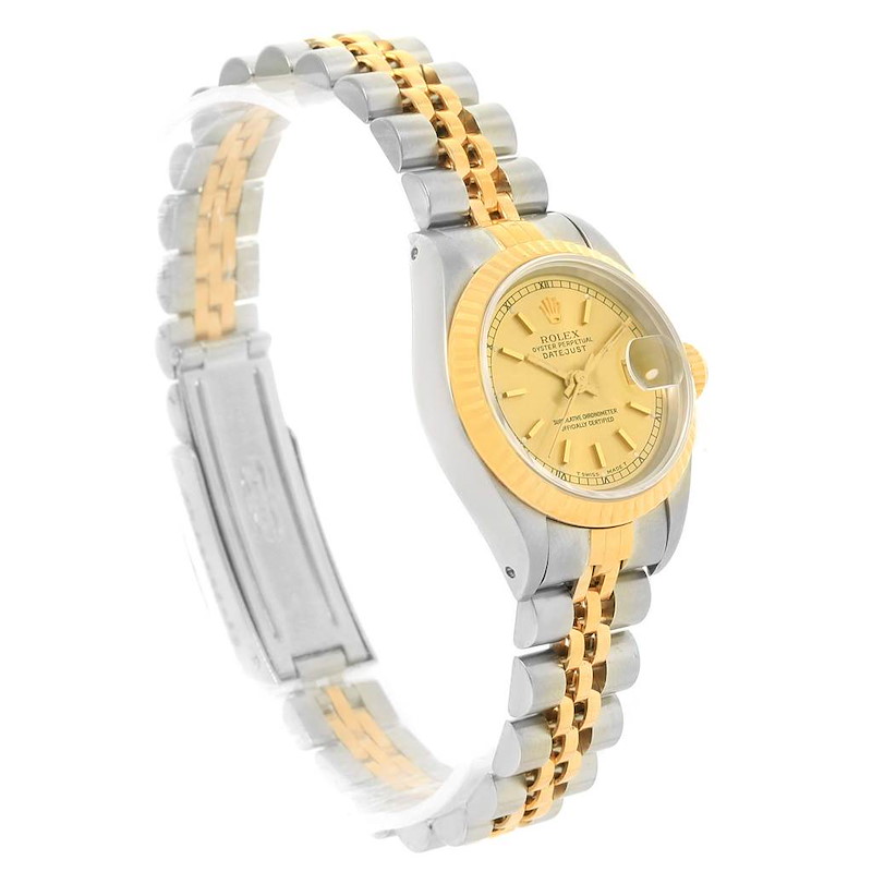 This is a side view of a Rolex Datejust watch, showing its gold and silver bracelet and the gold dial with fluted bezel.