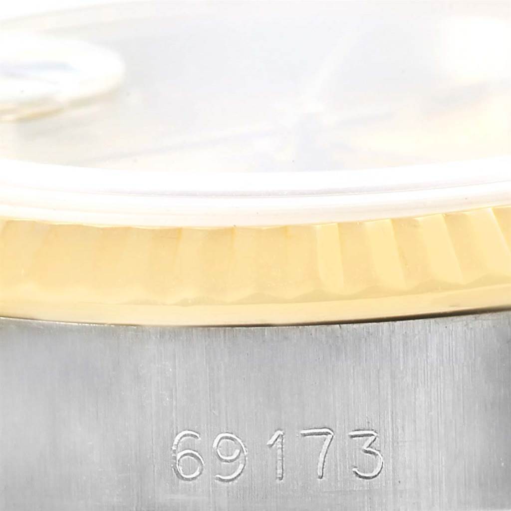 This image shows a close-up of the case side and fluted bezel of a Rolex Datejust 69173 Women's Stainless Steel Champagne Dial 69173 Women's Stainless Steel Champagne Dial model, with the reference number 69173 clearly visible.