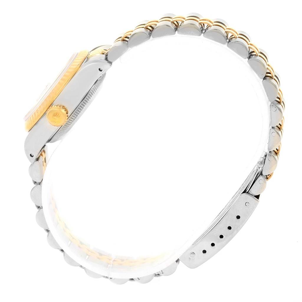 This side view of the Rolex Datejust 69173 Women's Stainless Steel Champagne Dial 69173 Women's Stainless Steel Champagne Dial shows the bezel, case, crown, and part of the bracelet.