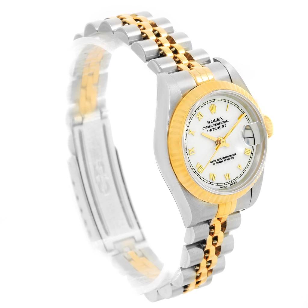 The image shows a Rolex Datejust 69173 Women's Stainless Steel White Dial 69173 Women's Stainless Steel White Dial watch from a three-quarter angle, highlighting its dial, fluted bezel, and Jubilee bracelet.