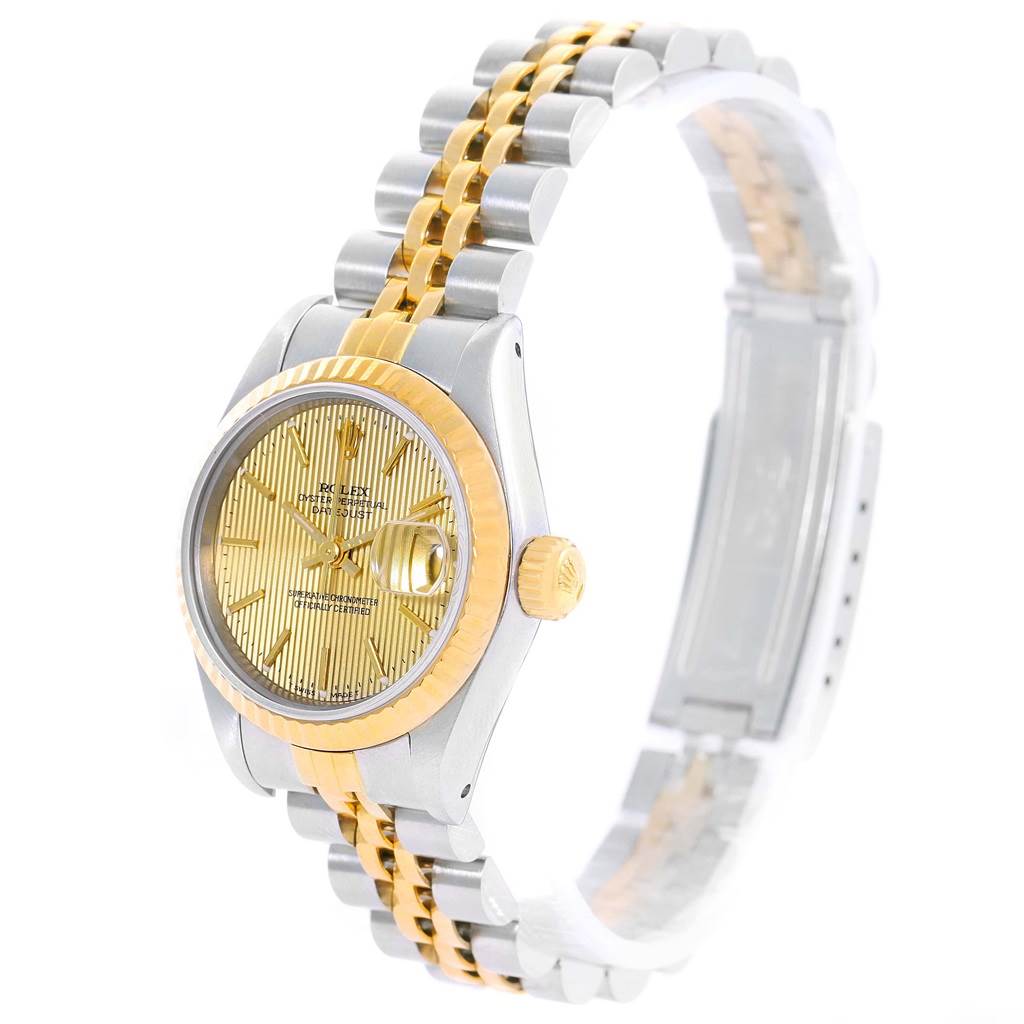 The image shows a side angle of a Rolex Datejust 69173 Women's Stainless Steel Champagne Dial 69173 Women's Stainless Steel Champagne Dial watch, highlighting its two-tone bracelet, fluted bezel, and gold dial.