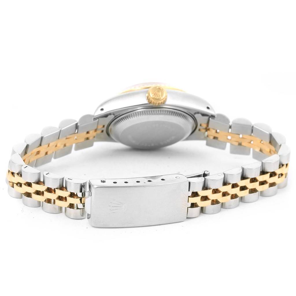 The image shows the back side of a Rolex Datejust 69173 Women's Stainless Steel Champagne Dial 69173 Women's Stainless Steel Champagne Dial watch and its two-tone metal bracelet with a closed clasp.