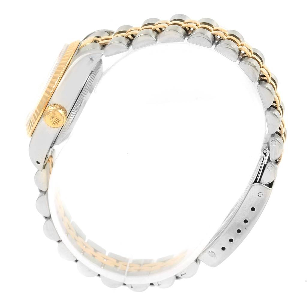 The image shows a side view of a Rolex Datejust 69173 Women's Stainless Steel Champagne Dial 69173 Women's Stainless Steel Champagne Dial watch, focusing on the crown and two-tone bracelet.