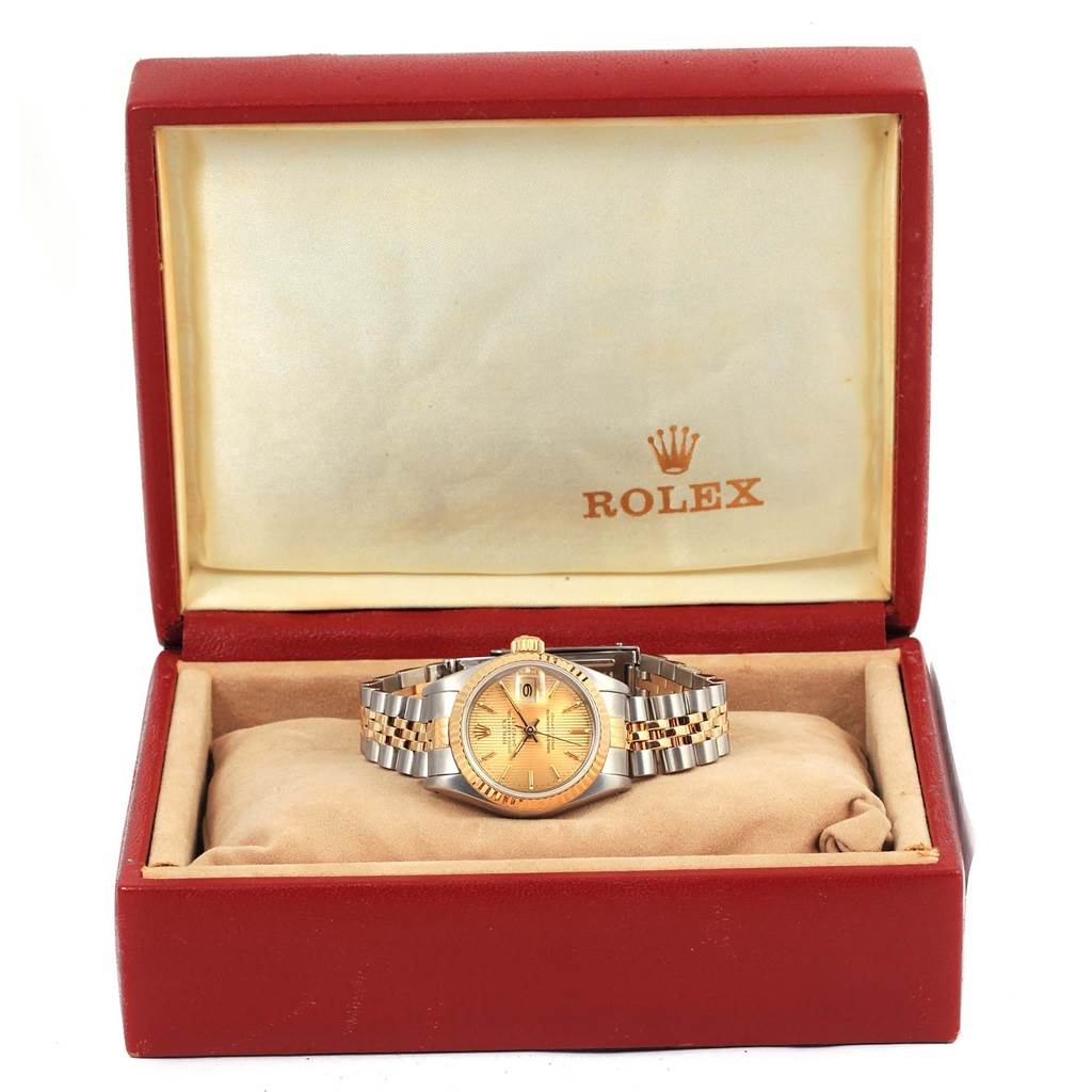The Rolex Datejust 69173 Women's Stainless Steel Champagne Dial 69173 Women's Stainless Steel Champagne Dial watch is displayed from a front angle inside its branded box, showcasing the dial, bezel, and bracelet.