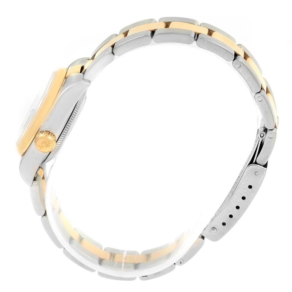 The image shows a side view of a Rolex Datejust 69163 Women's Stainless Steel Champagne Dial 69163 Women's Stainless Steel Champagne Dial watch, highlighting the two-tone bracelet and the crown.