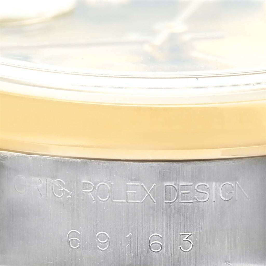 The image shows a close-up of the side of a Rolex Datejust 69163 Women's Stainless Steel Champagne Dial 69163 Women's Stainless Steel Champagne Dial watch, highlighting the "ORIG. ROLEX DESIGN" and model number "69163."