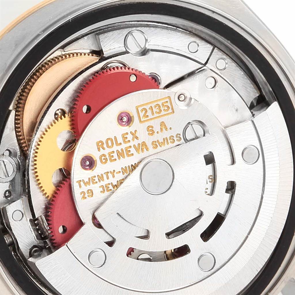 The image shows the internal movement mechanism of a Rolex Datejust 69163 Women's Stainless Steel Champagne Dial 69163 Women's Stainless Steel Champagne Dial watch, showcasing gears and the inscription "Rolex S.A. Geneva Swiss."
