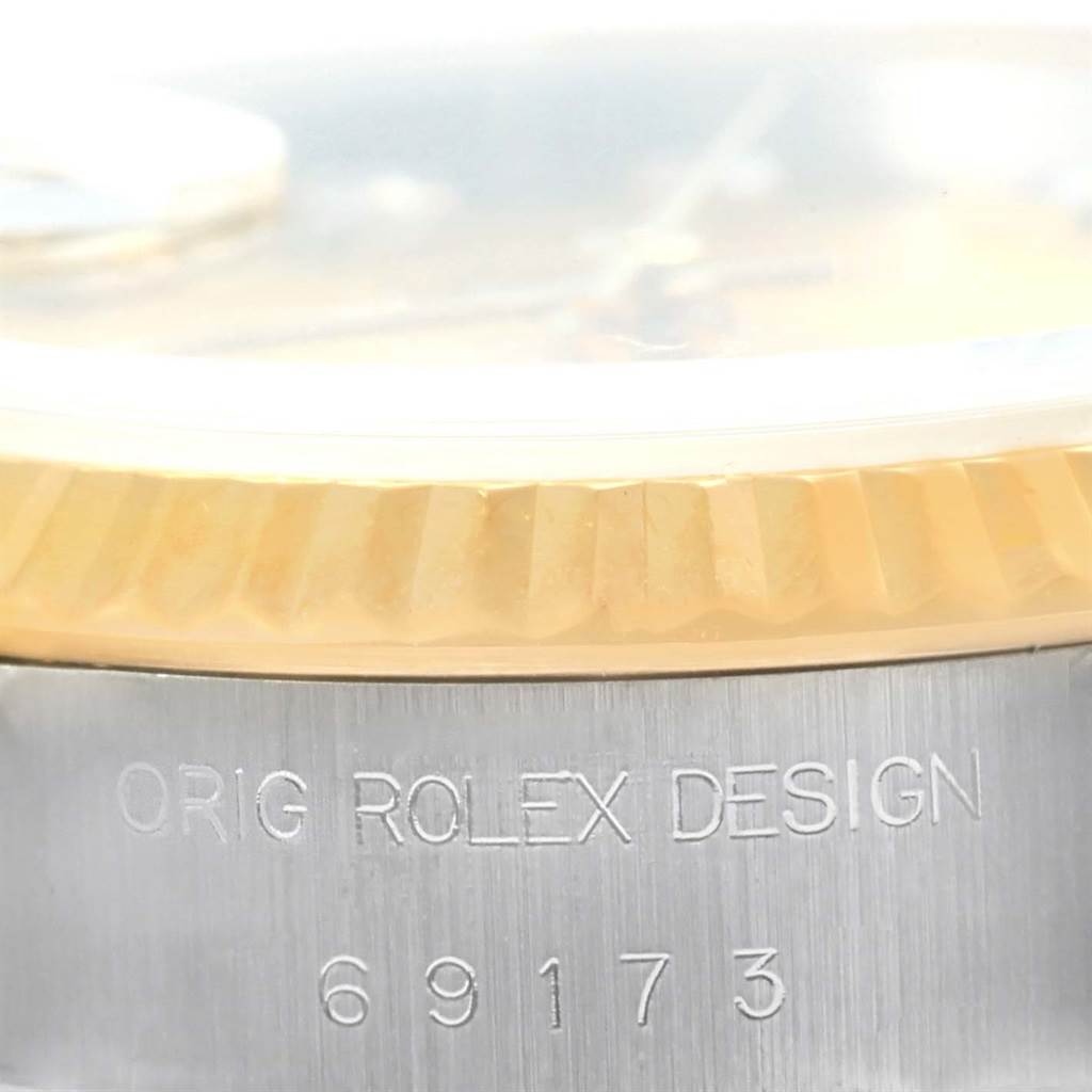 This image shows a close-up side view of a Rolex Datejust 69173 Women's Stainless Steel Champagne Dial 69173 Women's Stainless Steel Champagne Dial watch, displaying the bezel and part of the case with the engraved model number 69173.