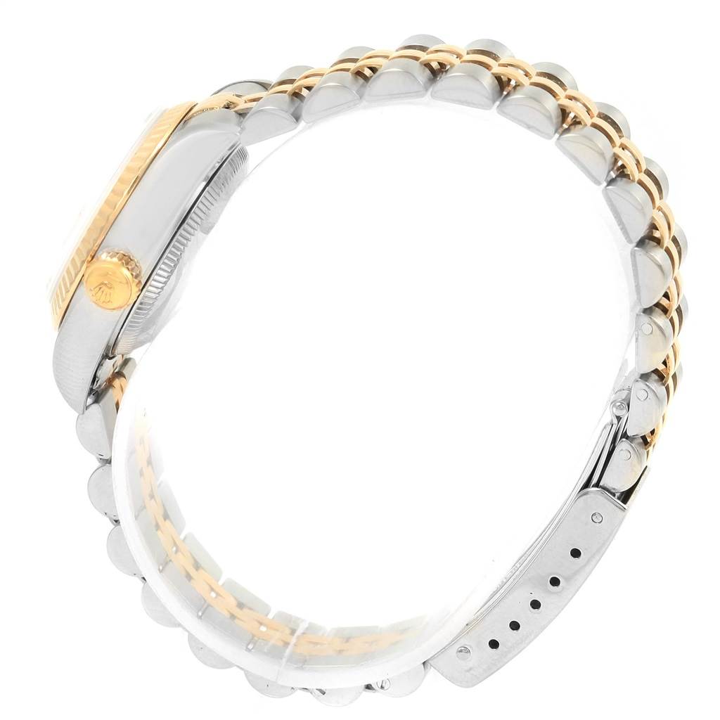 The image shows a side view of a Rolex Datejust 69173 Women's Stainless Steel Champagne Dial 69173 Women's Stainless Steel Champagne Dial watch, highlighting the crown and combination metal bracelet.