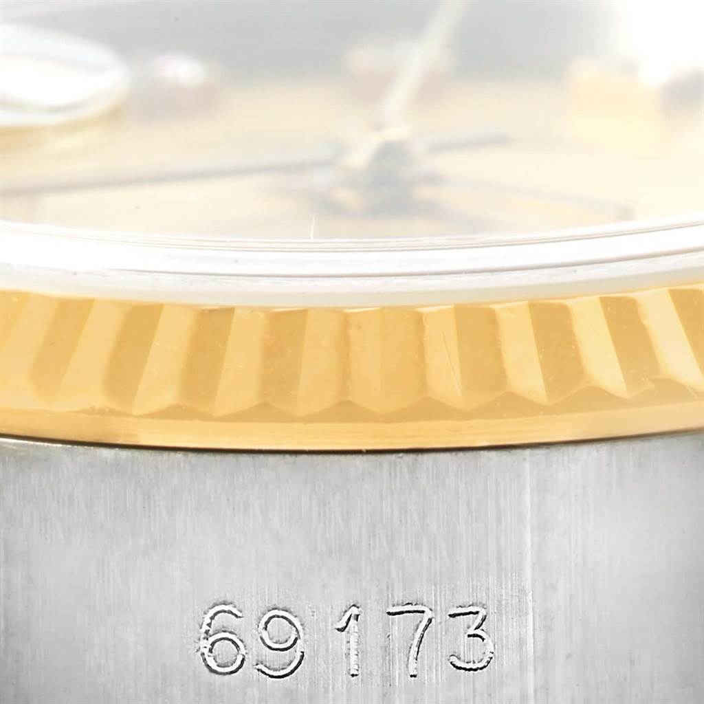 This image shows a close-up of the bezel and part of the case with the model number 69173 on a Rolex Datejust 69173 Women's Stainless Steel Champagne Dial 69173 Women's Stainless Steel Champagne Dial watch.