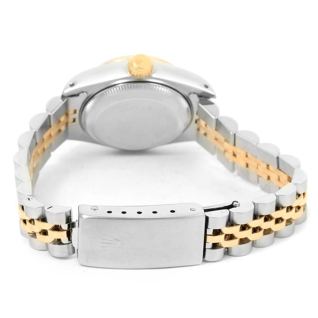 The image shows the back view of a Rolex Datejust 69173 Women's Steel and Gold (two tone) Blue Dial 69173 Women's Steel and Gold (two tone) Blue Dial watch, highlighting the case back, crown, and the two-tone bracelet with the clasp.