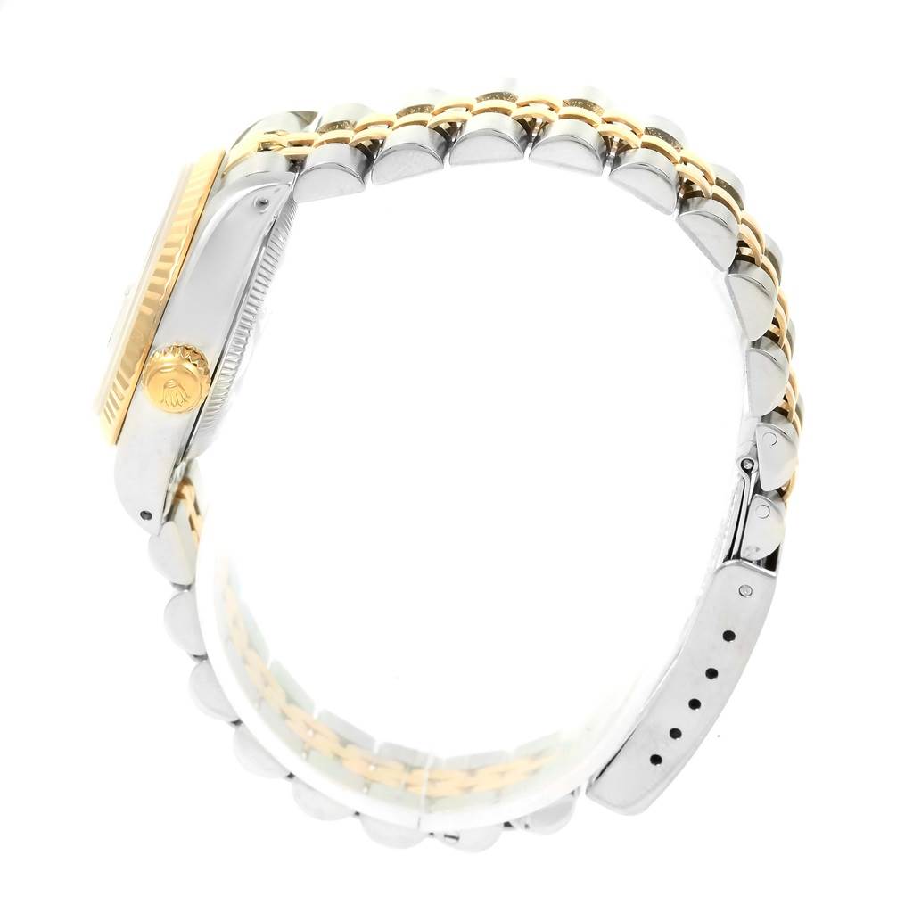 The image shows a side view of a Rolex Datejust 69173 Women's Steel and Gold (two tone) Blue Dial 69173 Women's Steel and Gold (two tone) Blue Dial watch, highlighting the crown, bezel, and bracelet.