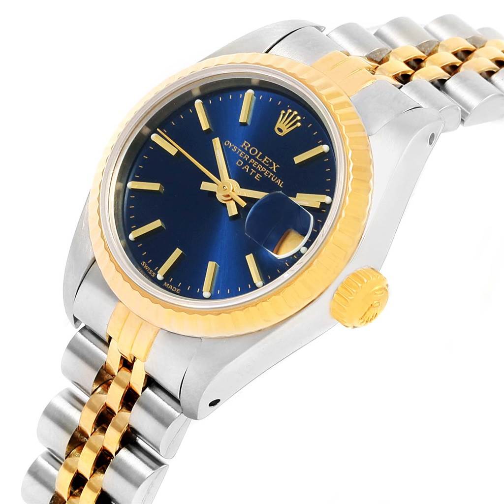 This image shows a Rolex Datejust 69173 Women's Steel and Gold (two tone) Blue Dial 69173 Women's Steel and Gold (two tone) Blue Dial watch angled from the top-right, highlighting the blue dial, gold bezel, and two-tone bracelet.