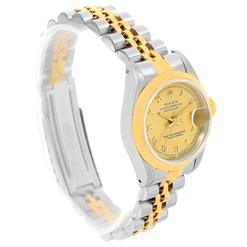 This Rolex Datejust 69173 Women's Steel and Gold (two tone) Champagne Dial 69173 Women's Steel and Gold (two tone) Champagne Dial watch is shown from a side angle, highlighting its dial, fluted bezel, and two-tone bracelet.