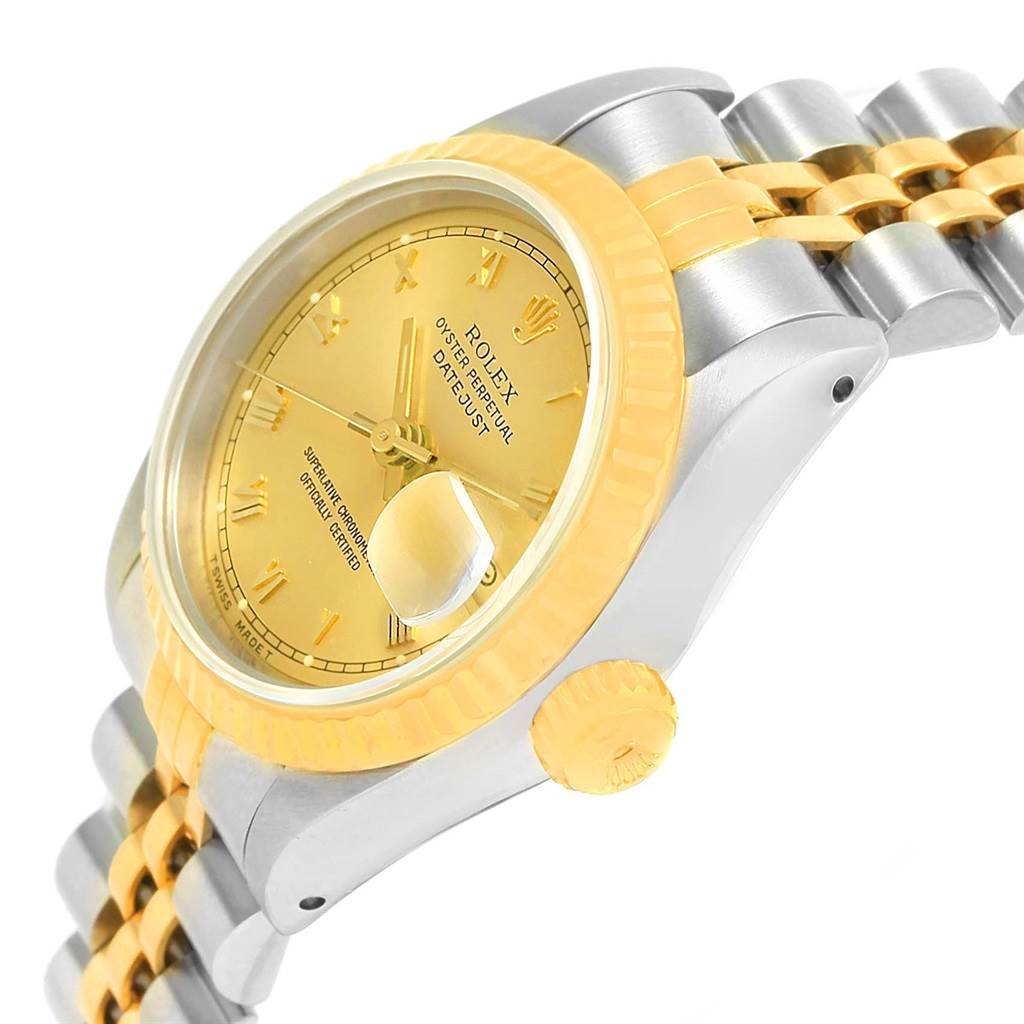 This image showcases a Rolex Datejust 69173 Women's Steel and Gold (two tone) Champagne Dial 69173 Women's Steel and Gold (two tone) Champagne Dial watch at an angled close-up, highlighting the gold dial, bezel, crown, and part of the bracelet.