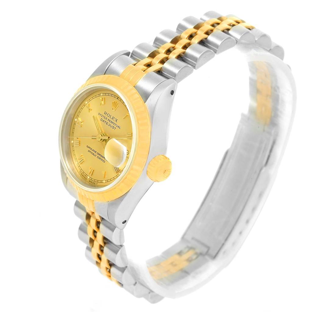This Rolex Datejust 69173 Women's Steel and Gold (two tone) Champagne Dial 69173 Women's Steel and Gold (two tone) Champagne Dial watch is shown at a slight angle from the side, highlighting the dial, bezel, crown, and bracelet.