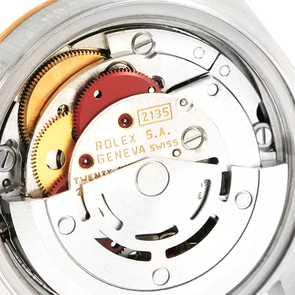 A close-up view of the internal movement components of the Rolex Datejust 69173 Women's Stainless Steel Black Dial 69173 Women's Stainless Steel Black Dial watch, showcasing gears and the rotor.