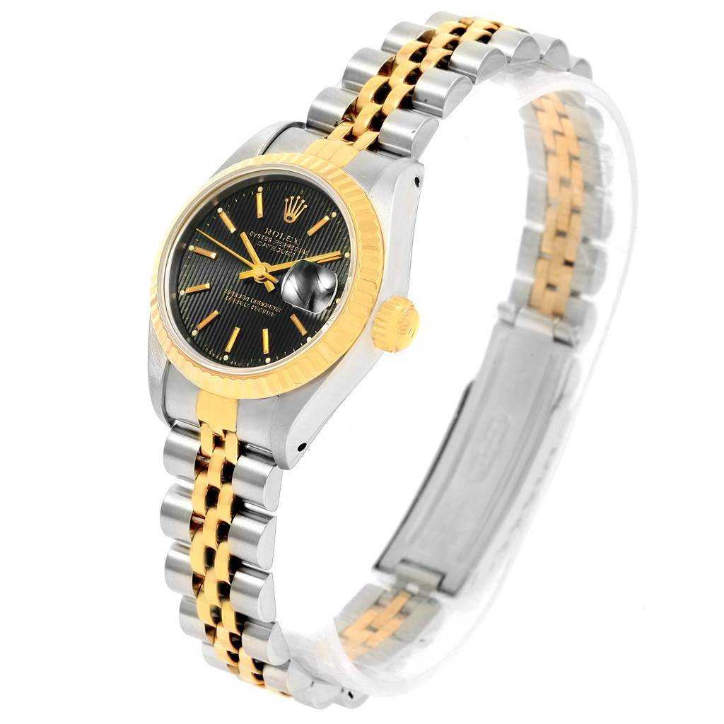 The image shows a Rolex Datejust 69173 Women's Stainless Steel Black Dial 69173 Women's Stainless Steel Black Dial watch from an angled side view, highlighting the face, bezel, crown, and bracelet.