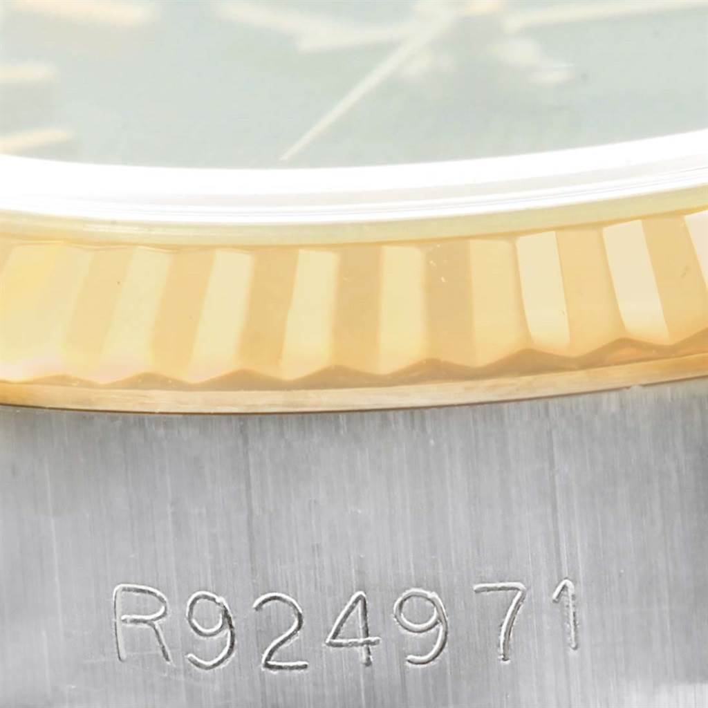This image shows a close-up of the bezel and part of the case of a Rolex Datejust 69173 Women's Stainless Steel Black Dial 69173 Women's Stainless Steel Black Dial watch, including a visible serial number.