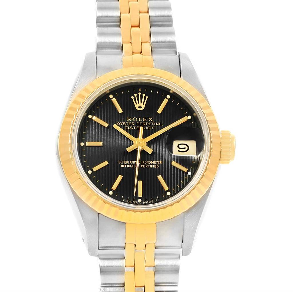 The image shows a front view of the Rolex Datejust 69173 Women's Stainless Steel Black Dial 69173 Women's Stainless Steel Black Dial watch, highlighting its black dial, gold bezel, gold crown, and two-tone bracelet.