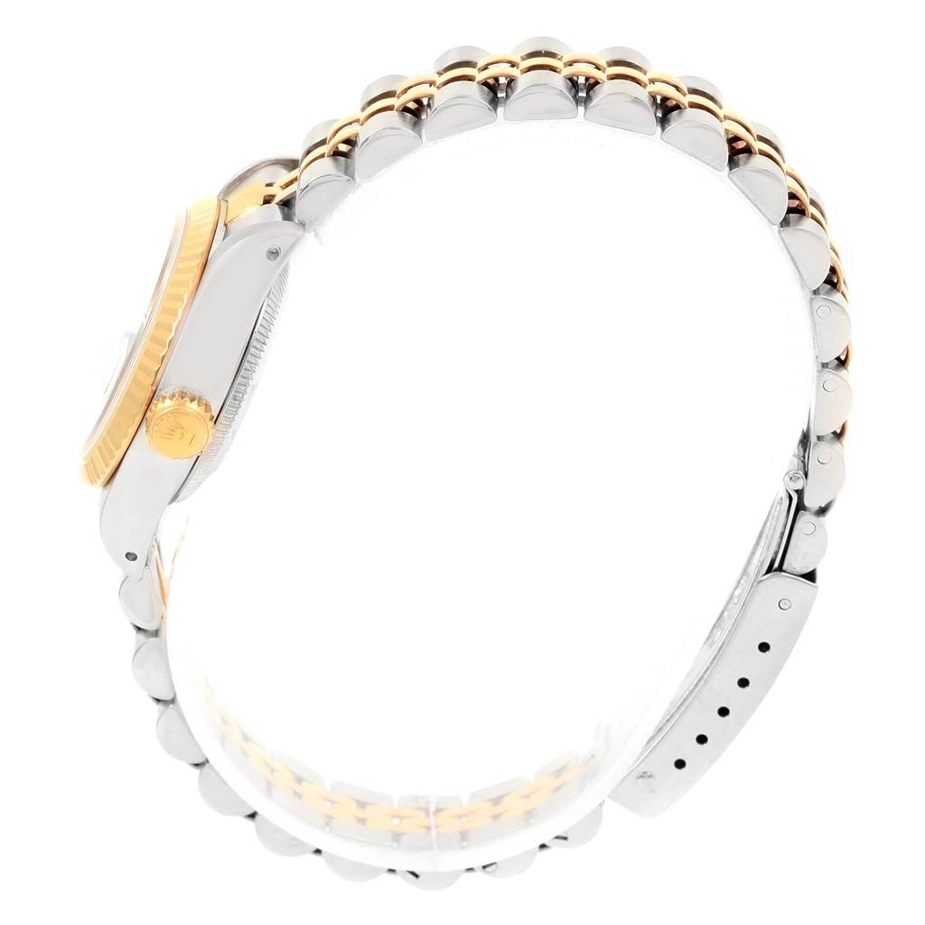 The image shows a side view of a Rolex Datejust 69173 Women's Stainless Steel Black Dial 69173 Women's Stainless Steel Black Dial watch, highlighting its bi-metal case and jubilee bracelet.