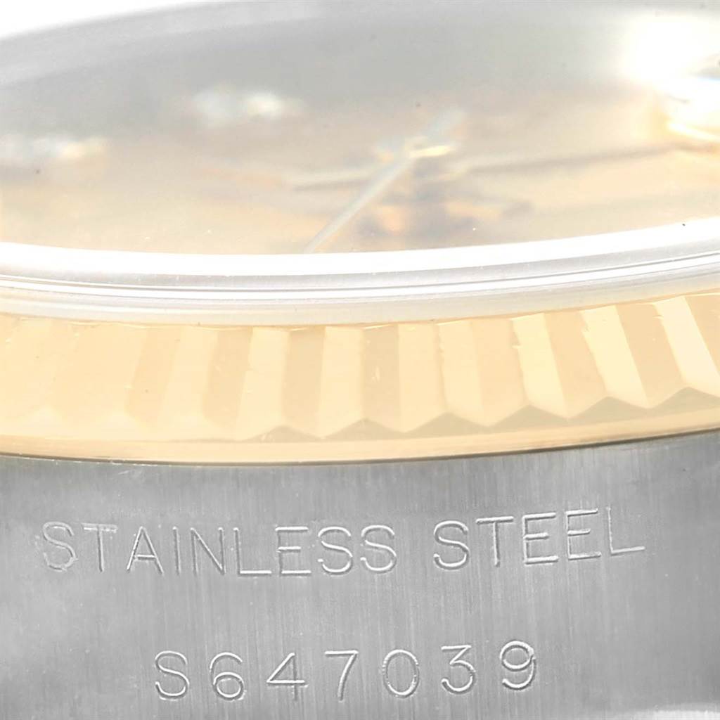 This close-up angle shows the stainless steel side and part of the fluted bezel of the Rolex Datejust 69173 Women's Stainless Steel Champagne Dial 69173 Women's Stainless Steel Champagne Dial model.
