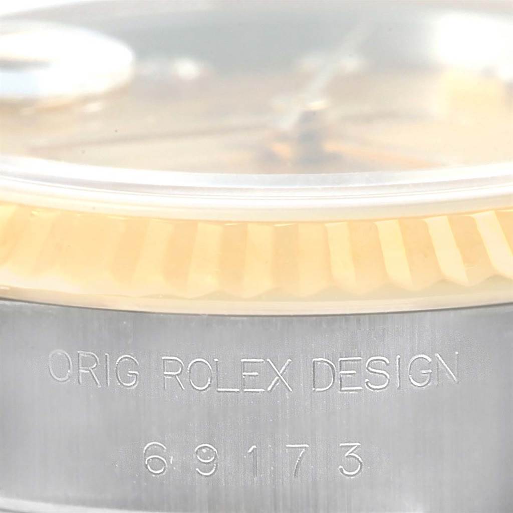The image shows a close-up of the case side and bezel of a Rolex Datejust 69173 Women's Stainless Steel Champagne Dial 69173 Women's Stainless Steel Champagne Dial, displaying the model number "69173" and "ORIG ROLEX DESIGN" engraving.