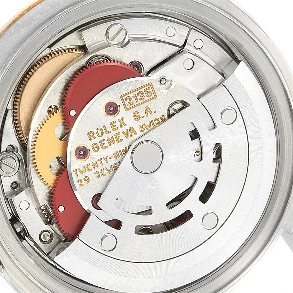 This is a close-up of the movement mechanism of a Rolex Datejust 69173 Women's Stainless Steel Champagne Dial 69173 Women's Stainless Steel Champagne Dial watch, showcasing its intricate inner components and gears.