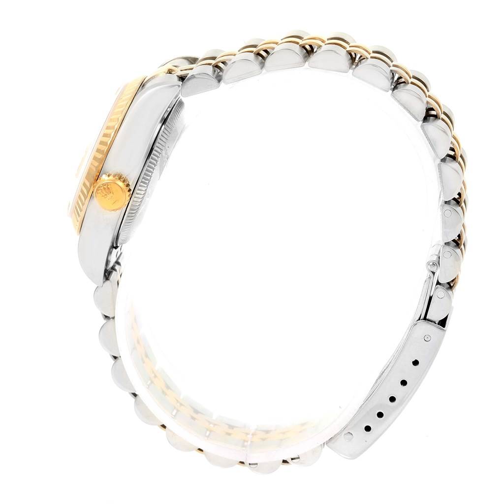 The image shows a side view of a Rolex Datejust 69173 Women's Stainless Steel Champagne Dial 69173 Women's Stainless Steel Champagne Dial watch, highlighting its two-tone bracelet and crown.