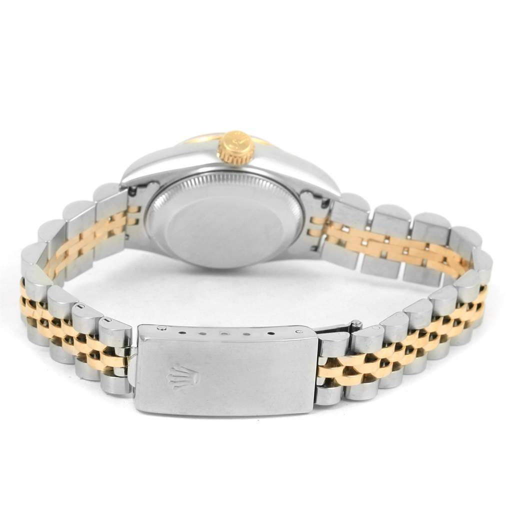 The image shows the back view of a Rolex Datejust 69173 Women's Stainless Steel Champagne Dial 69173 Women's Stainless Steel Champagne Dial watch, highlighting its caseback, crown, and two-tone bracelet with clasp.