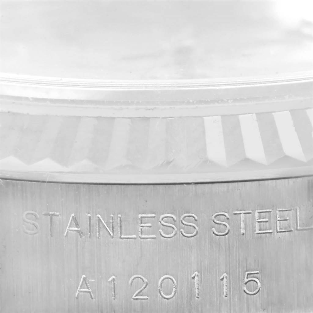 The image shows a close-up of the stainless steel case and fluted bezel of a Rolex Datejust 79174 Women's Stainless Steel Silver Dial 79174 Women's Stainless Steel Silver Dial model.