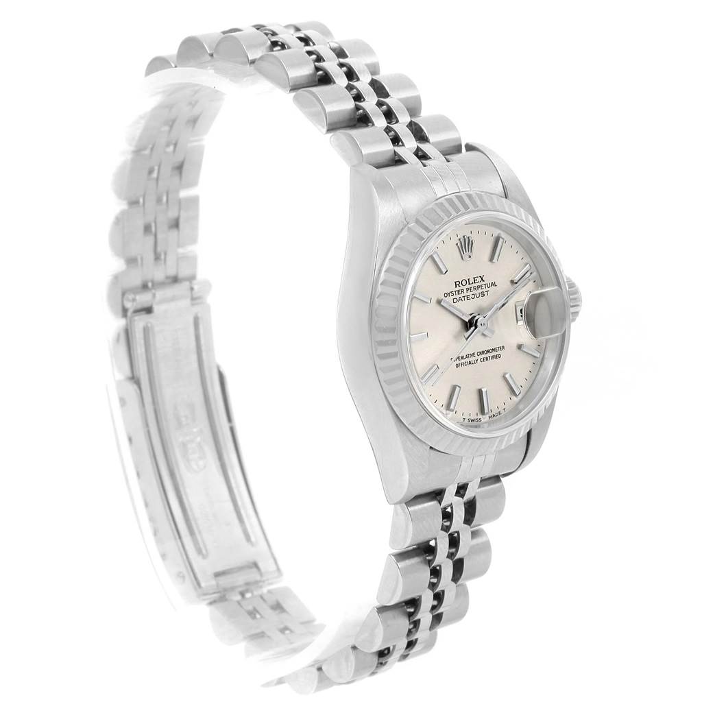 This image shows a side angle of a Rolex Datejust 79174 Women's Stainless Steel Silver Dial 79174 Women's Stainless Steel Silver Dial watch focusing on its face, bezel, and partially open bracelet.