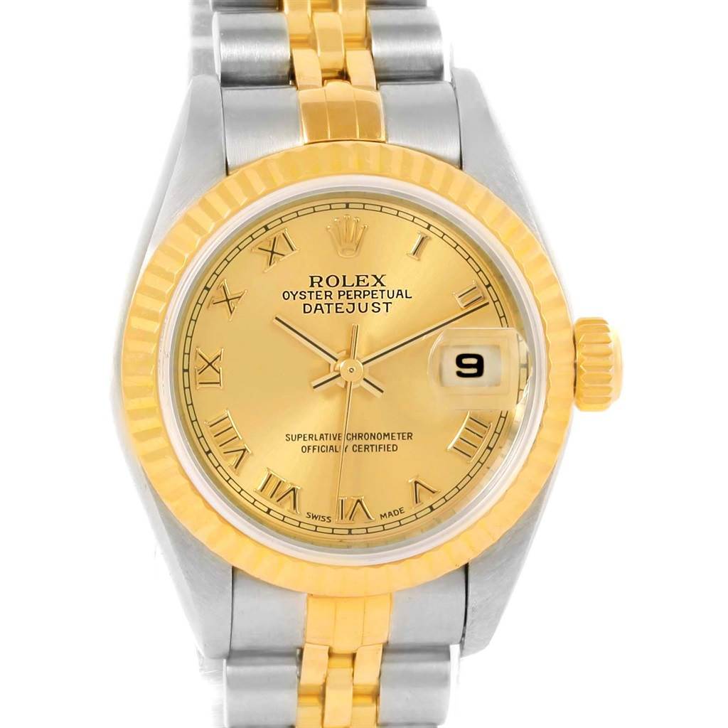 This Rolex Datejust 79173 Women's Steel and Gold (two tone) Champagne Dial 79173 Women's Steel and Gold (two tone) Champagne Dial watch is shown from a frontal angle, highlighting its dial, bezel, bracelet, and date window.