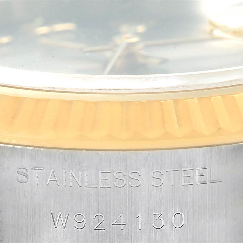 This image shows a close-up of the bezel and part of the dial of a Rolex Datejust 69173 Women's Stainless Steel Grey Dial 69173 Women's Stainless Steel Grey Dial watch, highlighting its stainless steel and gold components.