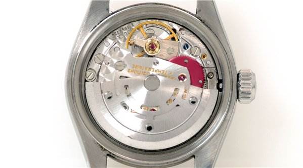 This is a rear view showcasing the internal movement mechanism of a Rolex Datejust 69174 Women's Stainless Steel Black Dial 69174 Women's Stainless Steel Black Dial watch.