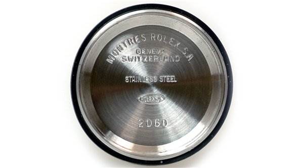 This is the stainless steel case back of a Rolex Datejust 69174 Women's Stainless Steel Black Dial 69174 Women's Stainless Steel Black Dial, viewed from a flat, top-down angle.