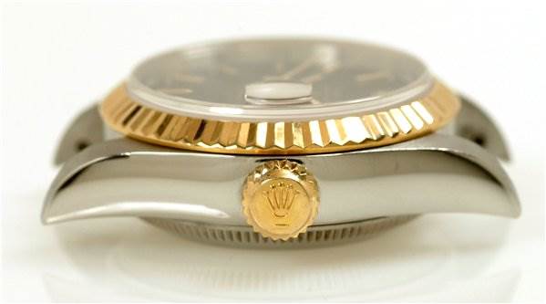 This image shows a side view of a Rolex Datejust 69173 Women's Stainless Steel Black Dial 69173 Women's Stainless Steel Black Dial watch, highlighting the crown and fluted bezel.