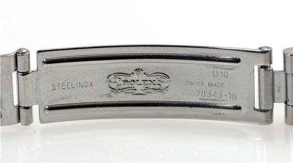 This image shows the inner clasp of a Rolex Datejust 69173 Women's Stainless Steel Black Dial 69173 Women's Stainless Steel Black Dial watch bracelet, featuring markings and the brand logo.